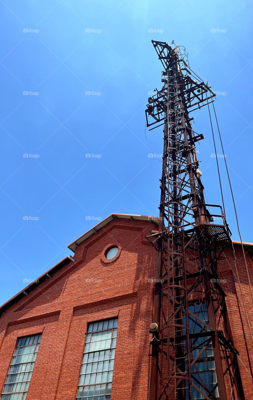 Light tower and brick warehouse