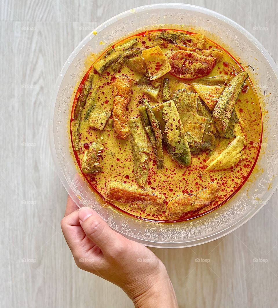 Asian food includes lala clam soup, curry fish head, bitter gourd pork and crispy twin tower noodles 