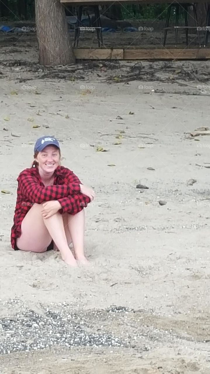 Woman sitting on a beach!
