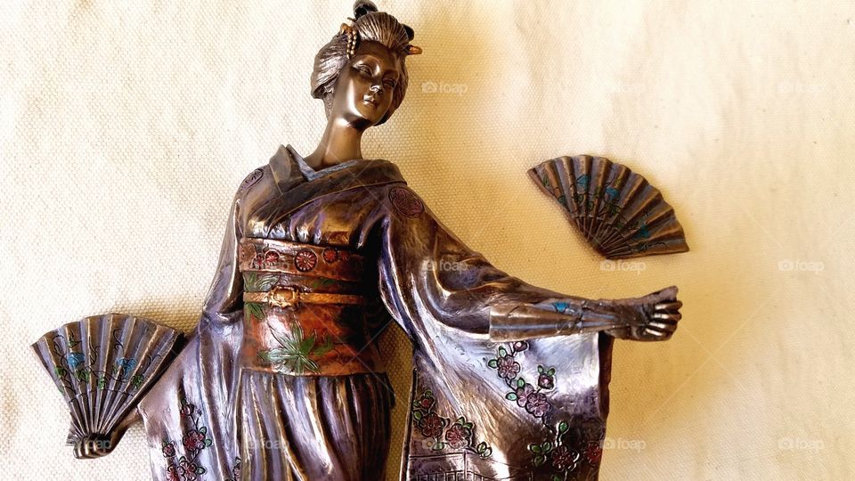 Geisha with broken hand fan