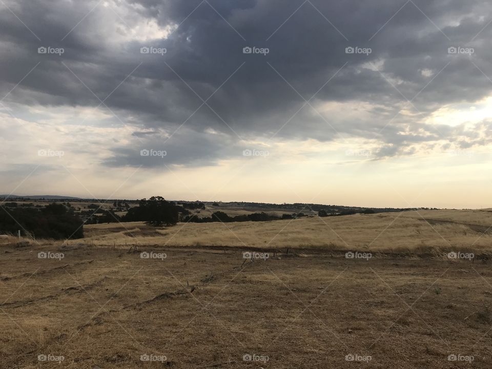 Moving clouds across the grey skies 