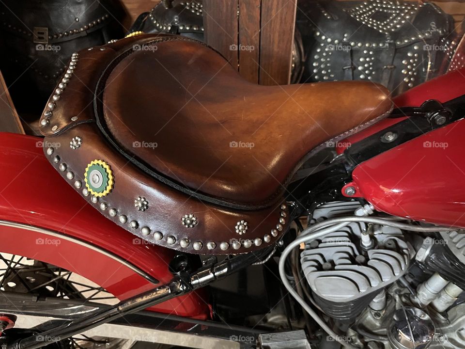 Ornate leather seat on a vintage Harley Davidson motorcycle 