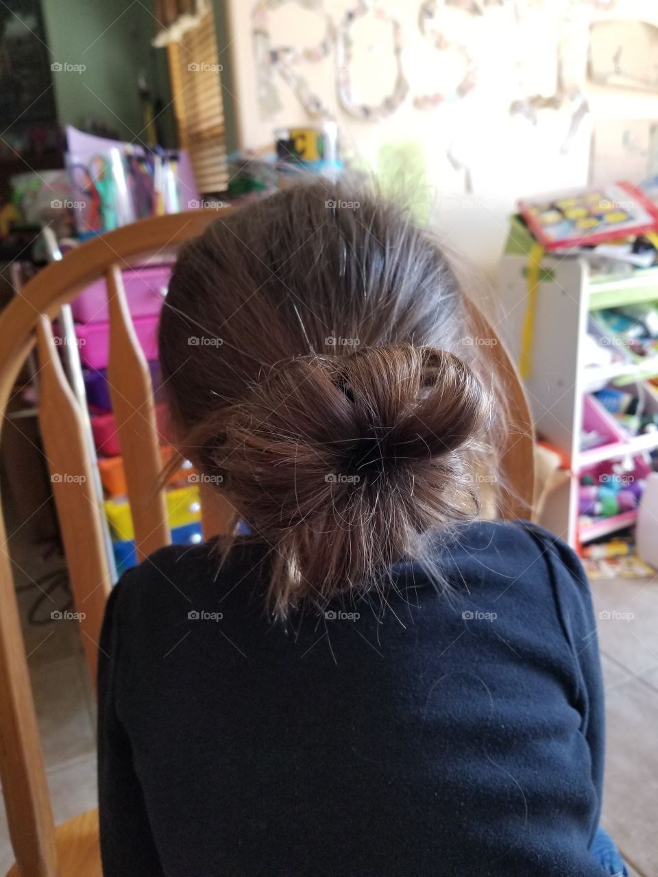 girl with hair in bun