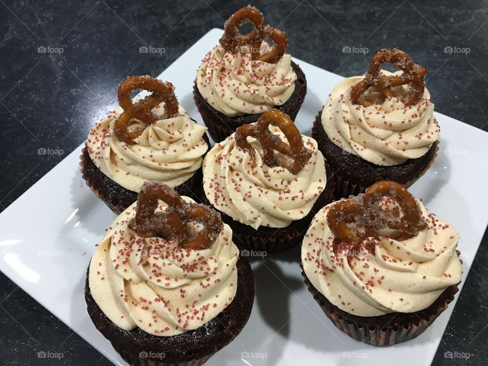 Milk Chocolate Cupcake with Caramel Buttercream with Cinnamon Sugar Pretzel 