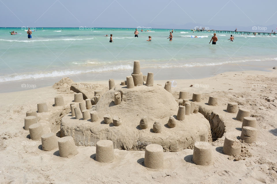 Sandcastle on a beach in Majorca Spain.