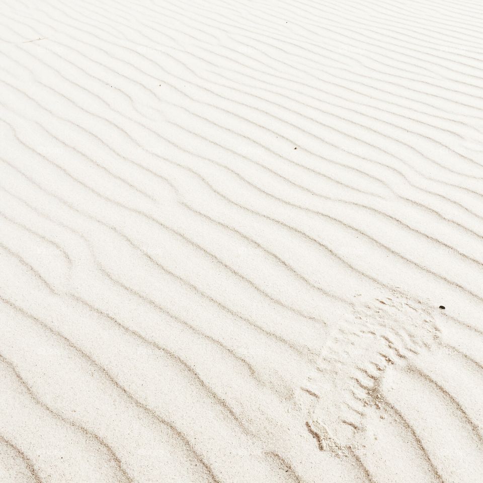 Footprint on white sand