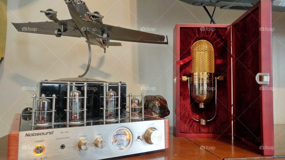 vacuum tube radio amplifier and vintage gold microphone