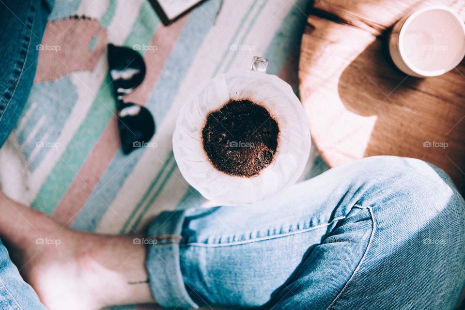 Make a cup of coffee at home and cozy up on a colorful rug.