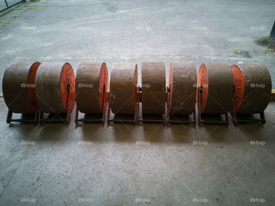 Row of heavy duty weights used when checking the lifting mass of an industrial elevators.