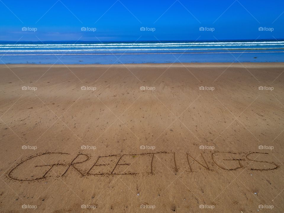 Greetings beach writing 