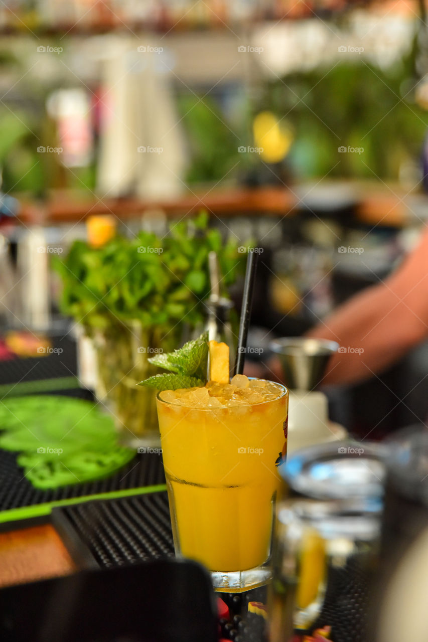 Orange cocktail in drinking glass