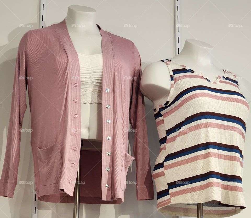 barbie style pink top and sweater on display in a women's clothing store in Oregon