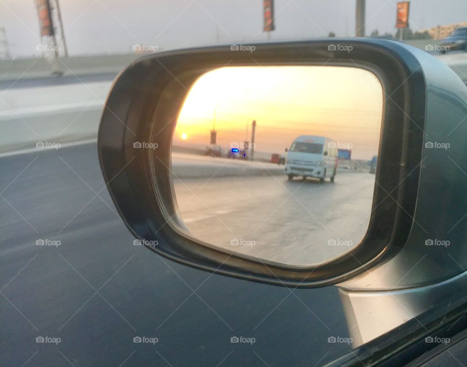 Sunset in side mirror 