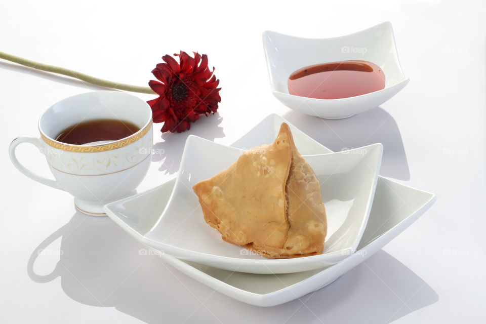 Indian dish samosa in white cutlery