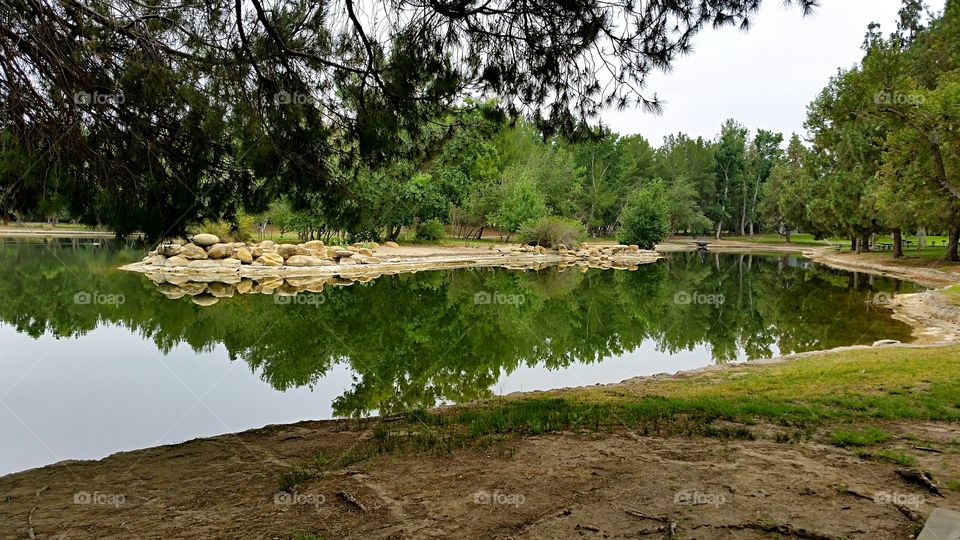 Large rocks in the lake.. A small island of large rocks in the lake.