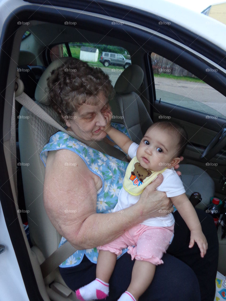baby   touching grandma