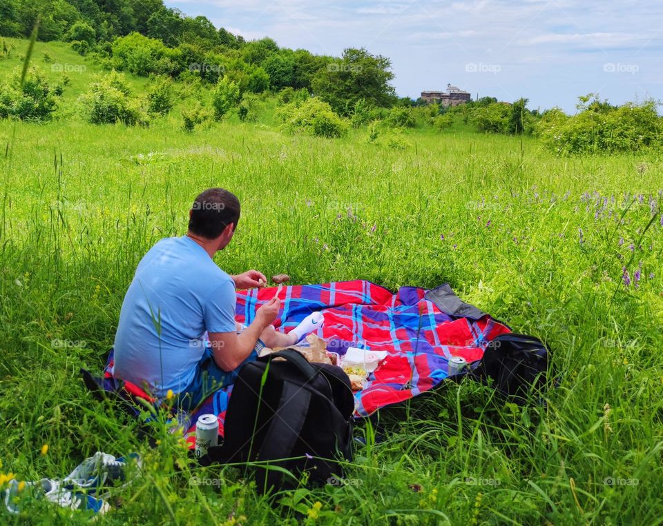 Picnic on the green meadow