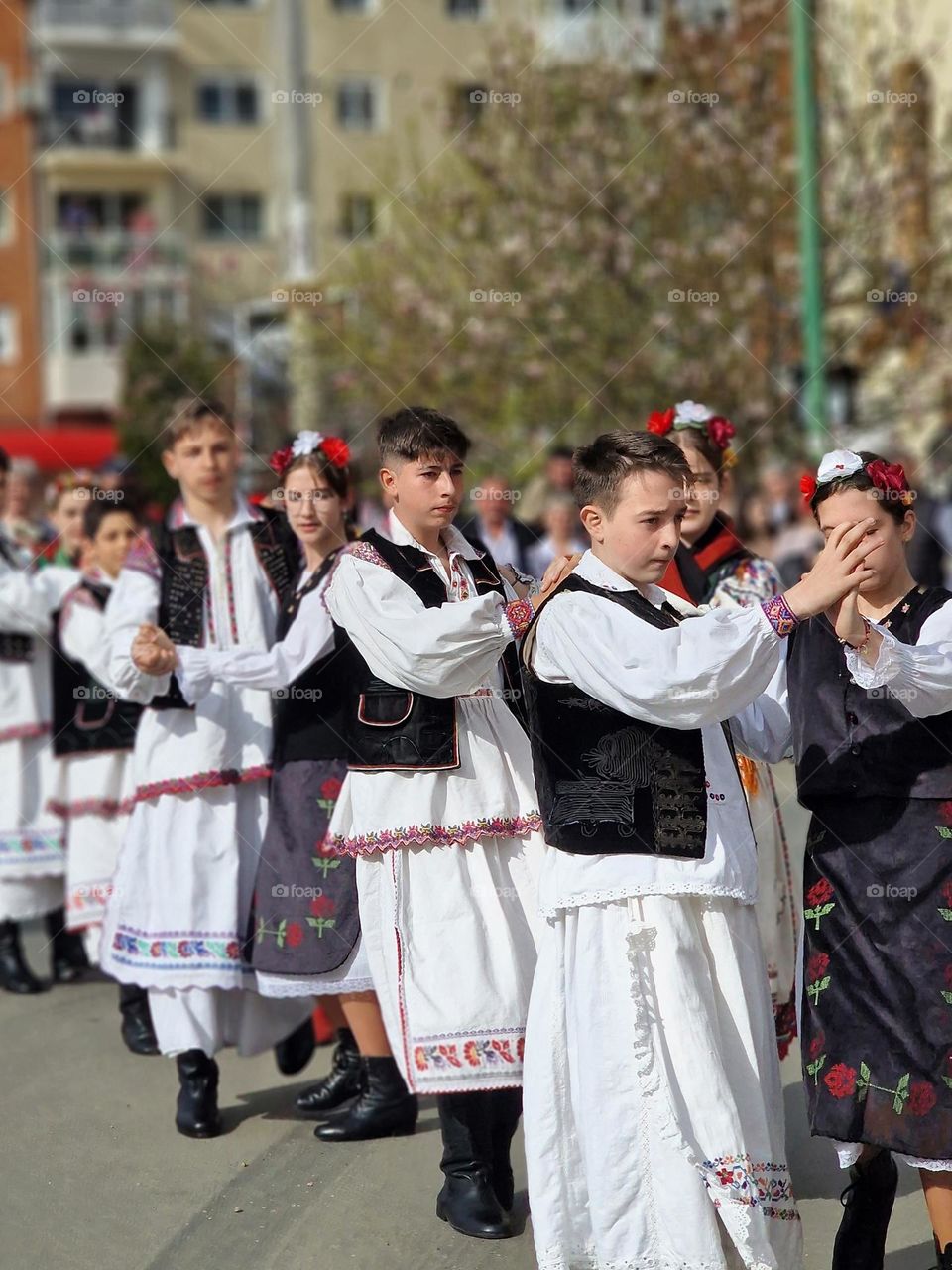 dancing in traditional Romanian costumes