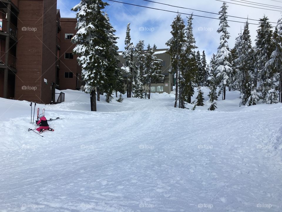 Girl plays with her skis 