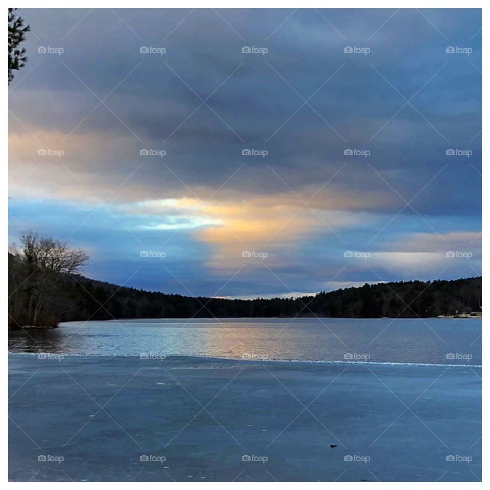 Half frozen lake in Massachusetts. Strange it’s usually all frozen this time of winter. Amazing sunset nonetheless.