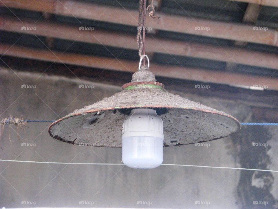 Close-up of light bulb on the ceiling