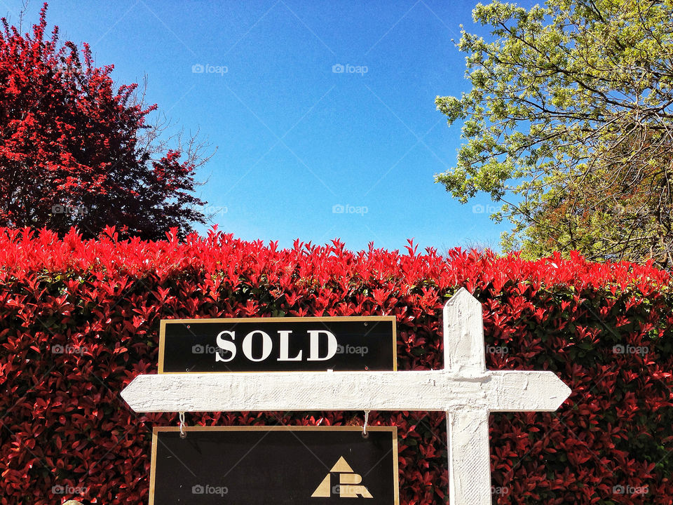 For sale sold sign in front of newly sold real estate property