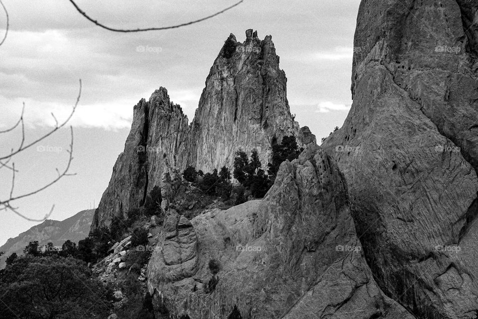 Black and white image of a red rock spire