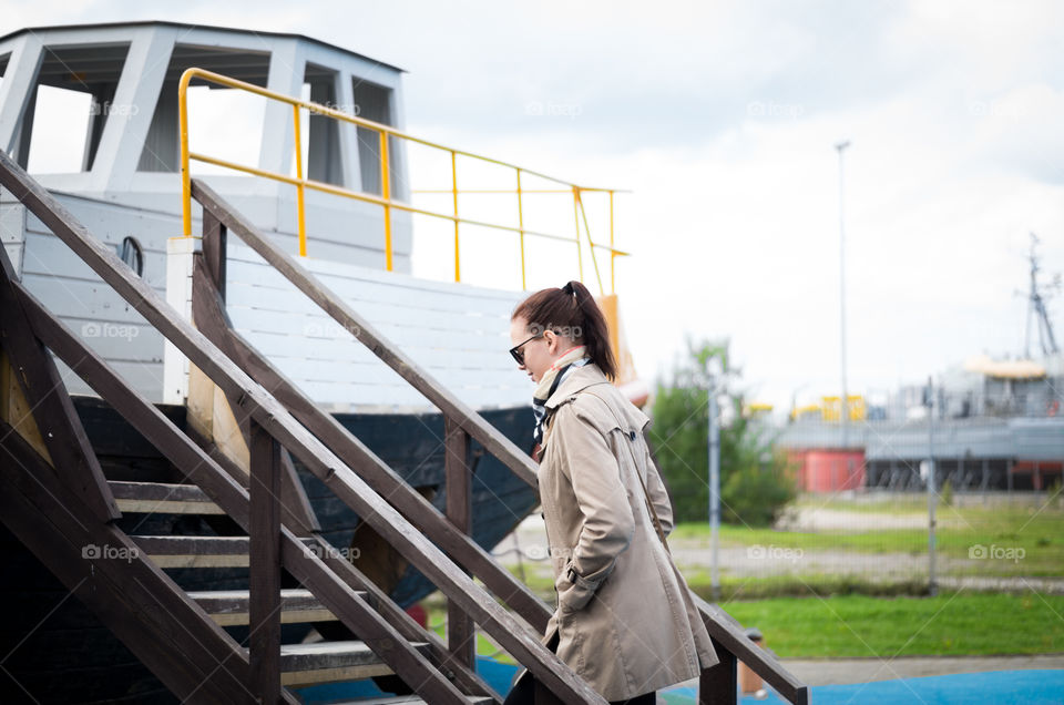 Side view of a woman walking on staircase