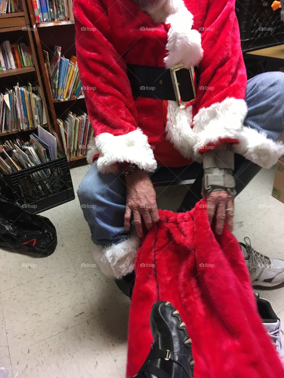 Santa getting his red suit on so he can see the kids!
