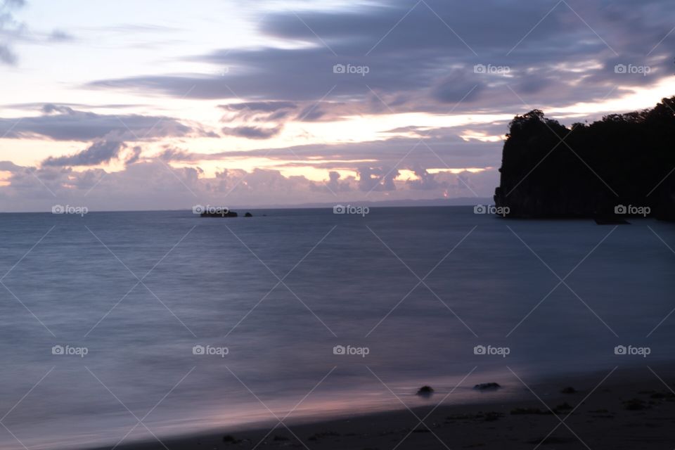 Waiting for Sunrise at the beach, the sun light slowly comes out from the pacific.....