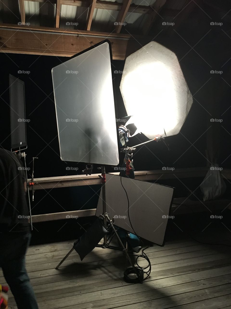 Lighting set up on dock, simulating moonlight, on a film set.