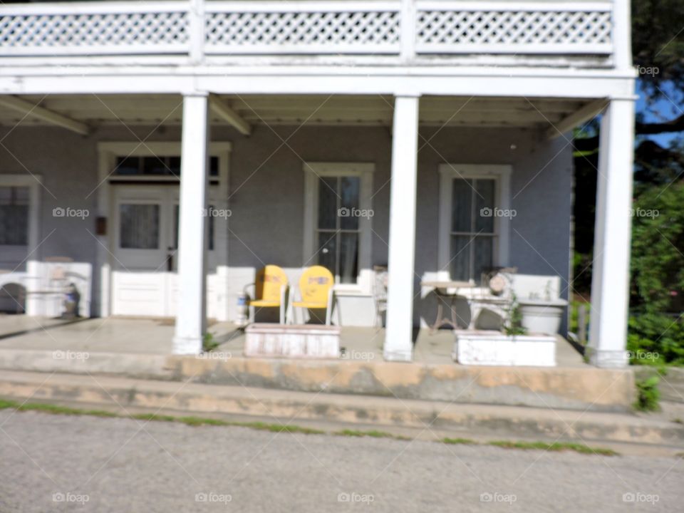 Yellow chairs on porch 