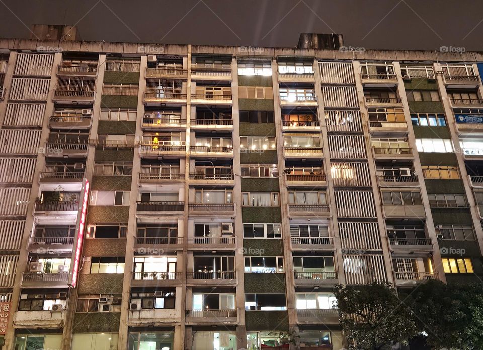 Like neat matchboxes, the apartment features night shots of lighted window views