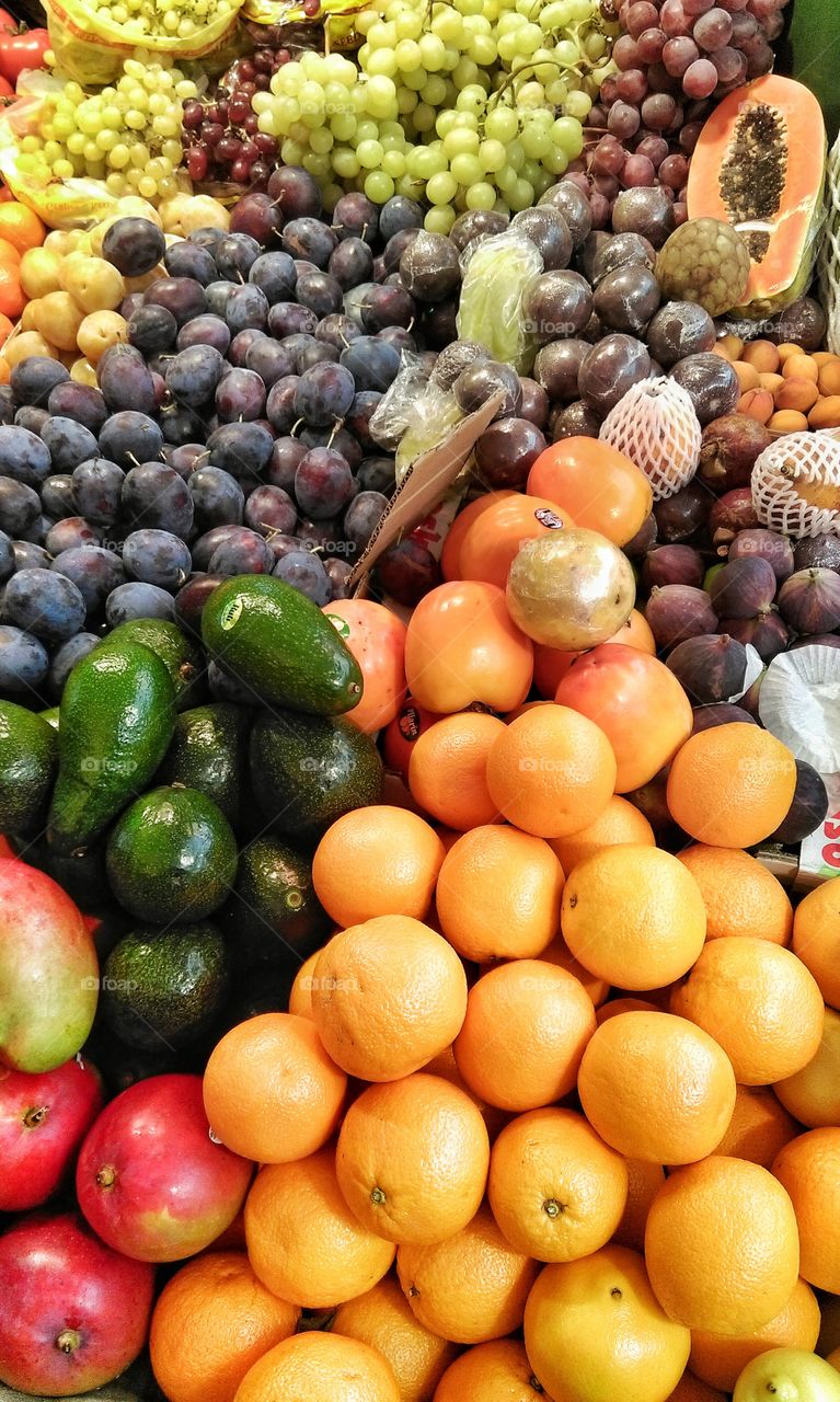 Market with various colorful fresh fruits and vegetables