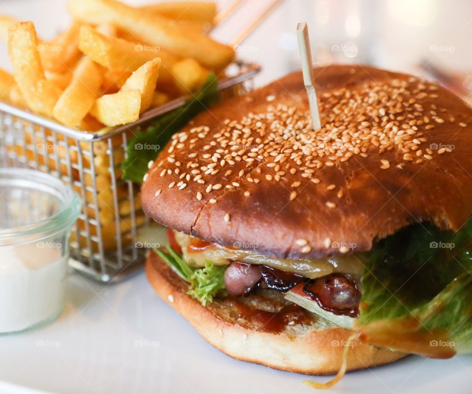 Close-up of  french fries and hamburger