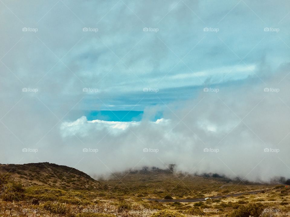 Above clouds top of the volcano 