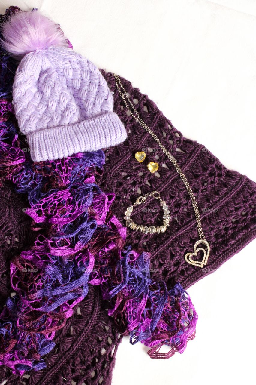 Purple winter clothing flatlay