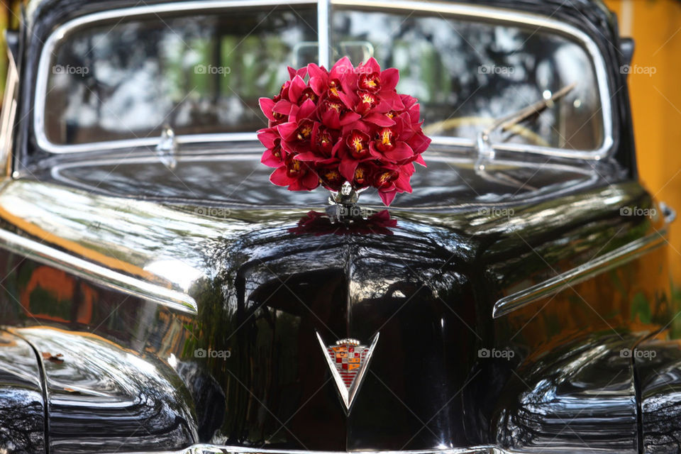 Fancy vintage Cadillac limousine elegant luxury car, flower bouquet on