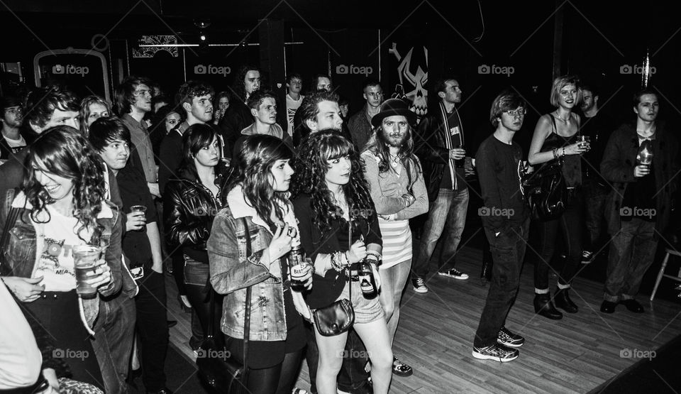 A crowd watches live music at Flairz pub, in Hastings UK 
