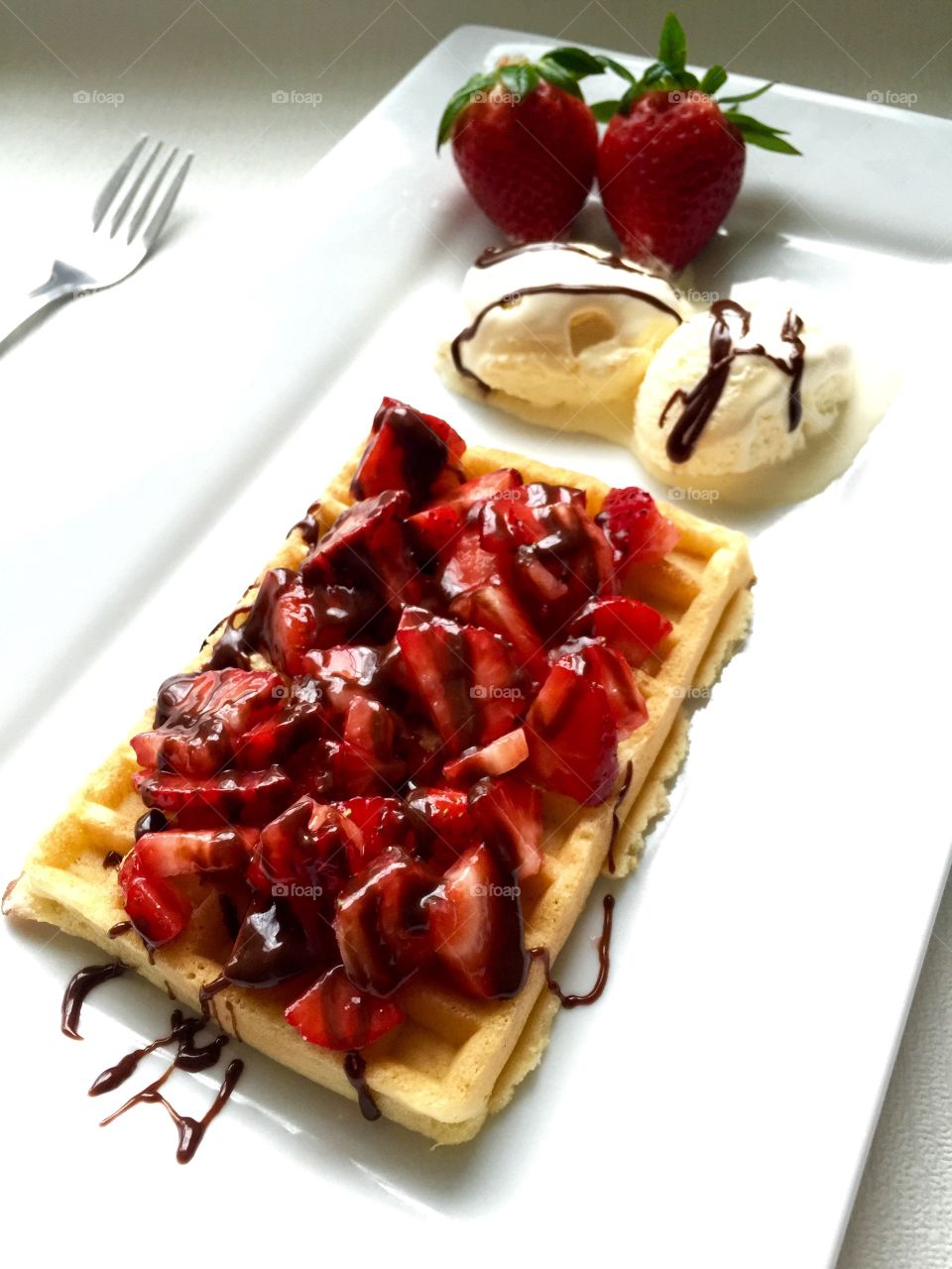 Strawberries waffle with ice cream   