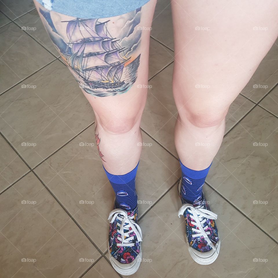 long legs, galleon tattoo, shark socks, rocketdog trainers. legs that go all the way up. sexy knees and socks on point.