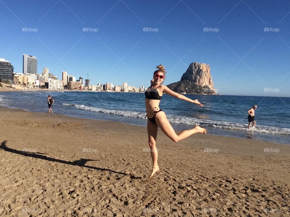 Me making a happy jump at the beach
