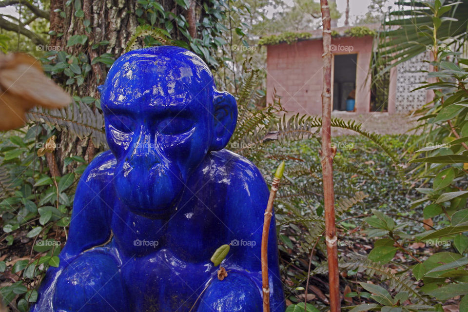 Blue monkey statue in a garden Point Clear Alabama