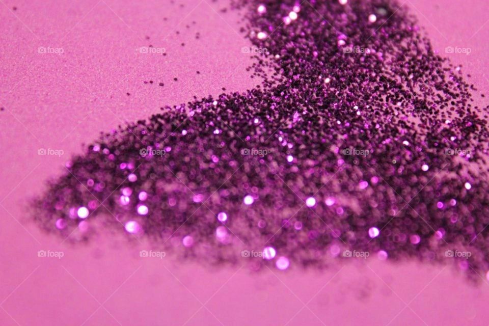 Purple glittering on pink background