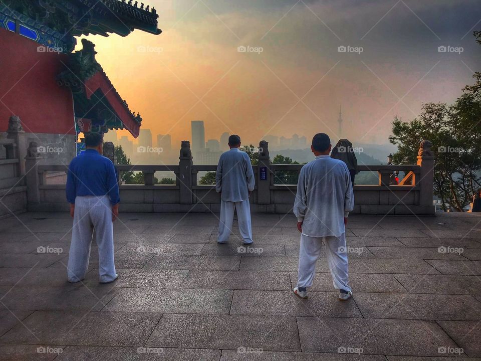 Morning exercises - Ready for Taiqiquan... facing the sunrise ready for martial arts practice 
