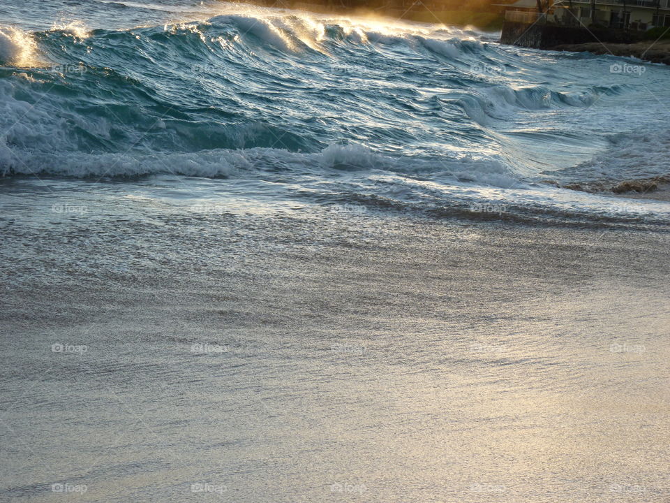 Wave hitting Makaha Beach