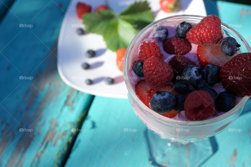 Fruit smoothie in glass on table