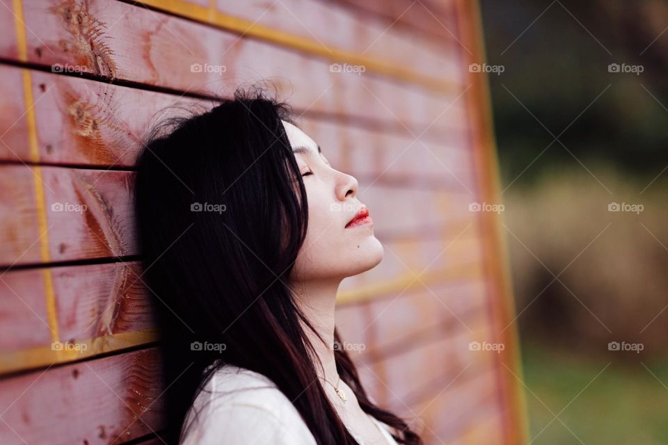 Young Asian woman feeling sadness outdoor 