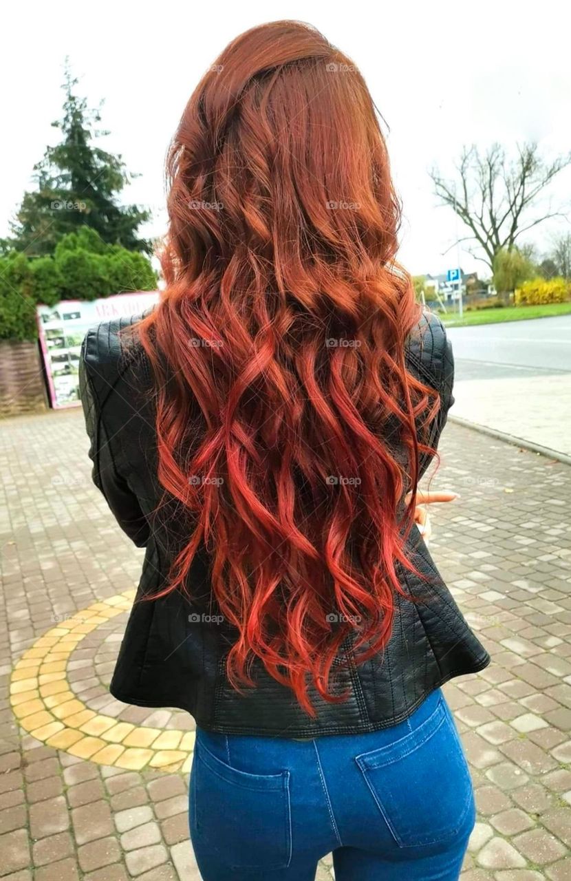 Long, curly red hair