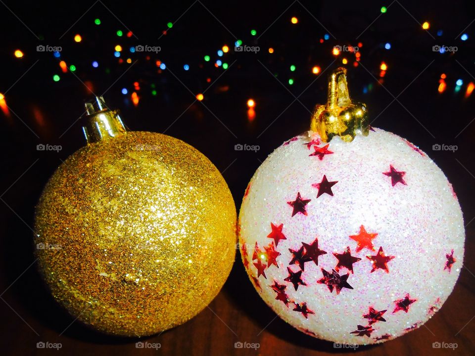 Christmas globes with lights in the background